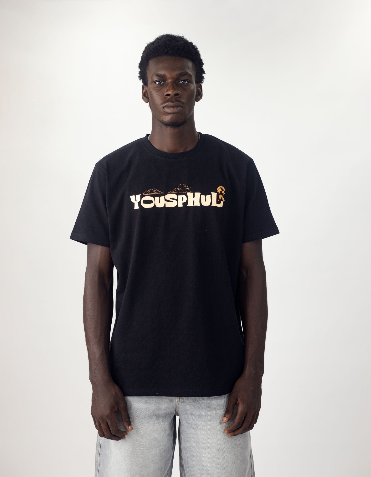Model wearing Yousphul Walk the Earth Tees in Black color
